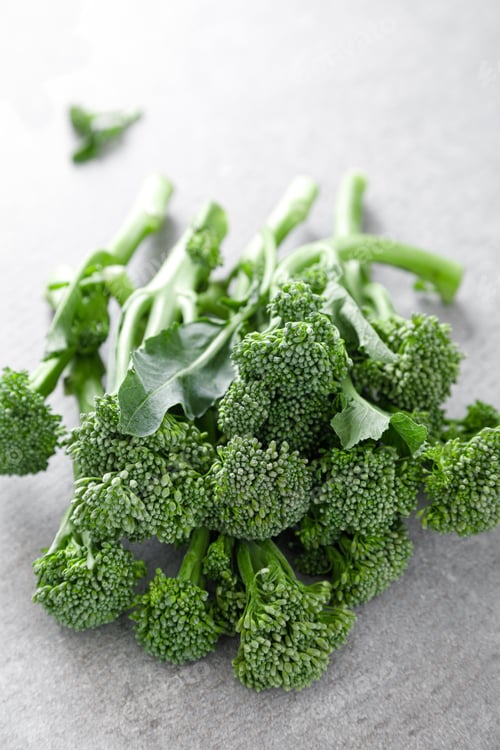 Preview: Broccolini. Fresh bunch of broccoli sprouts on a cooking table. Healthy food concept