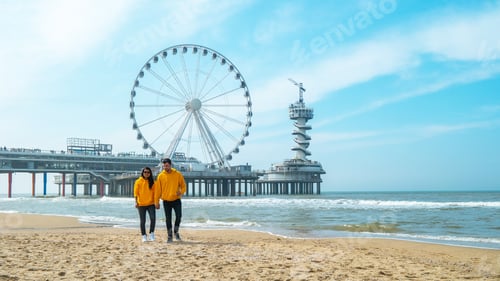 Preview: couple on the beach of Scheveningen Netherlands during Spring
