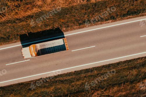 Preview: Aerial shot of truck with empty wagon on the road