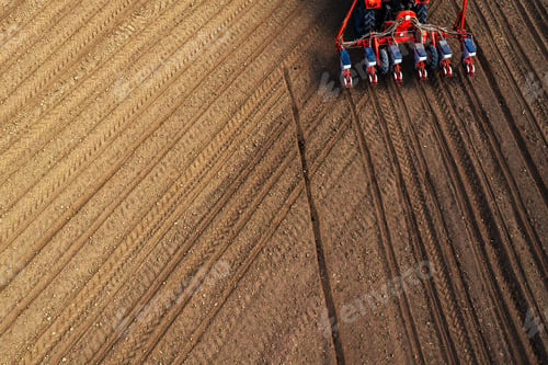 Preview: Drone pov tractor sowing corn in field