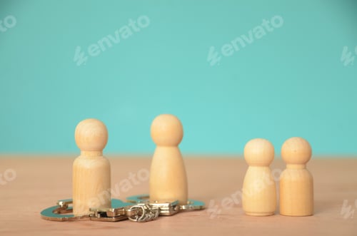 Preview: the potential conflict or division,represented handcuffs restraining two members the family group