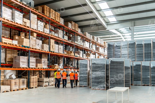 Preview: Warehouse workers inspecting logistics inventory management system