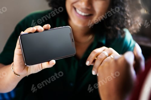 Preview: Woman showing a blank phone