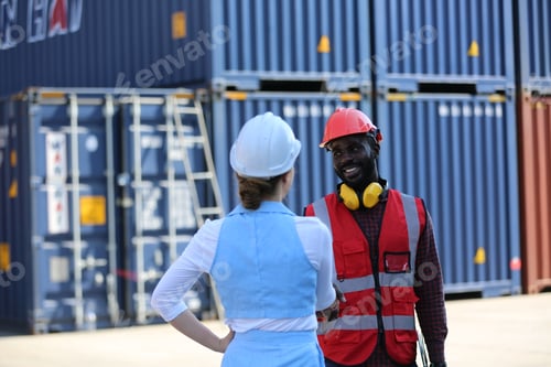 Preview: Foreman control loading Containers box from Cargo freight ship for import export.