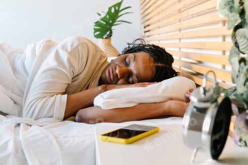 Preview: Serene woman sleeping soundly in bed, embracing peaceful slumber