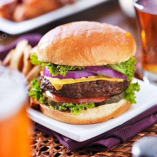 Preview: cheeseburger with beer and french fries close up