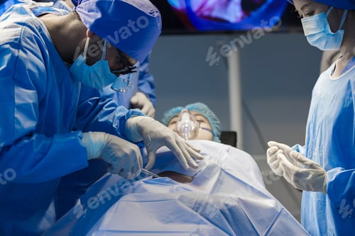 Preview: Operating Room Team Performing Surgical Procedure