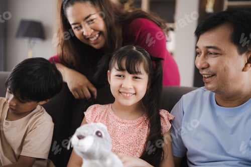 Vista previa: Family portrait with smiling child at home