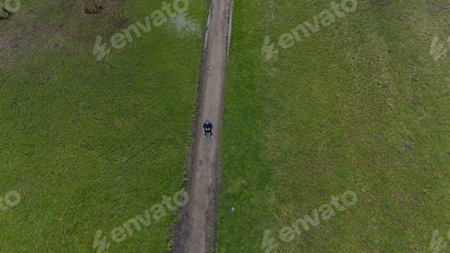 Preview: man looking up to see his drone