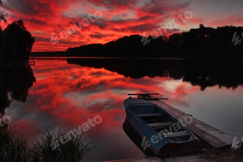Preview: Sunset on the lake, fishing boat on the shore