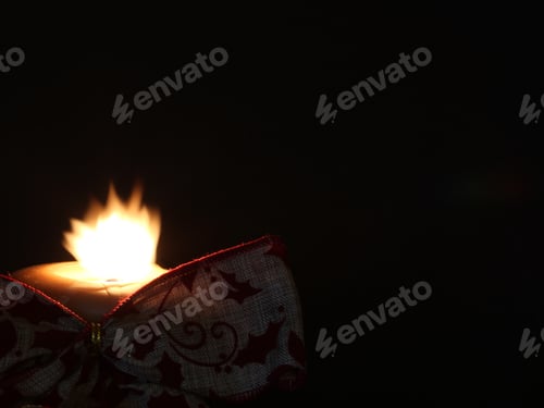 Preview: Burning Candle With Burlap Ribbon - Photograph Of A Burning Candle With A Moving Flame And A Burlap