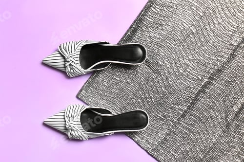 Preview: Pair of lady's shoes on color background, top view with space for text