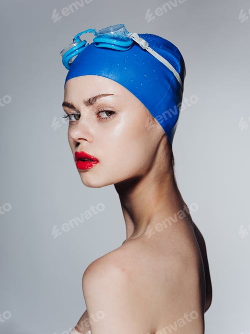 Preview: Woman in cap and goggles for swimming naked shoulders model portrait side view