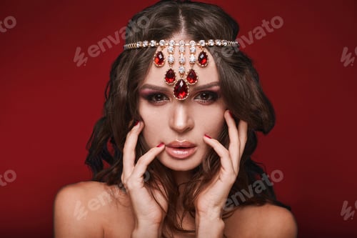 Preview: Beauty Portrait Of Young Swag Sexy Woman With Curly Long Hair And Jewerly On Red Background In