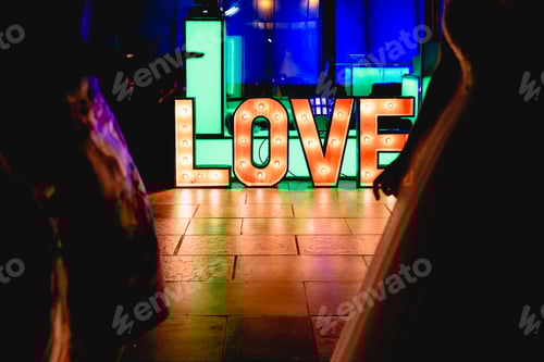 Preview: Illuminated Love Sign at Nighttime Wedding Reception