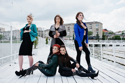 Preview: Group of sexy models girls in black bra and leather jackets on the dock