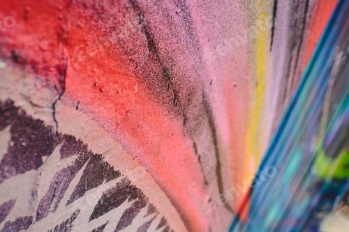 Preview: Detail of an anonymous street graffiti with many colors, cheerful urban background.