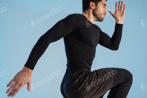 Preview: Young athletic sportsman doing exercise while working out