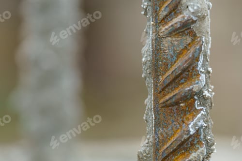 Preview: an old metal pipe sticking out of a dirt ground behind it