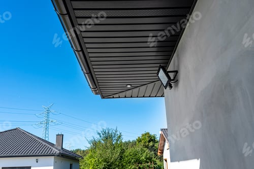 Preview: A modern graphite herringbone roof lining is attached to the trusses, visible turned on LED lights.