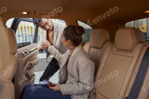 Preview: Gallant man helping woman out of car