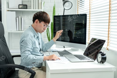 Preview: Male programmer is programming to develop program app and website of corporate while working