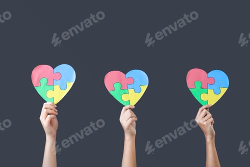 Preview: People Hands Holding Puzzle With Heart Shape. Autism Spectrum Disorder Family Support Concept.