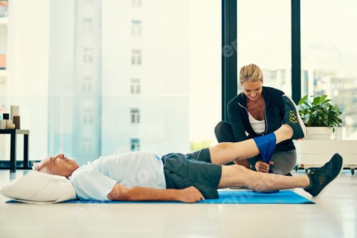 Preview: Senior Man Stretches Leg with Help of Woman