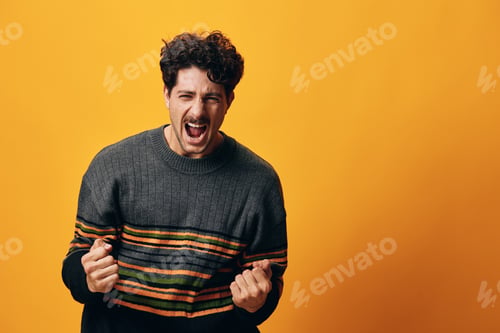 Preview: Man happy background orange student sweater portrait smile young gesture trendy fashion