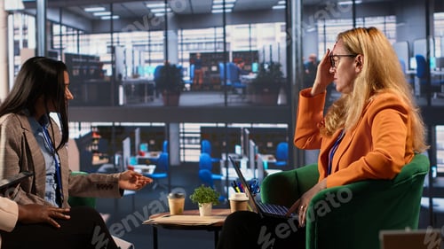 Preview: Female executive feeling sick and exhausted in a meeting to discuss strategies