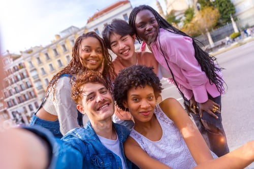 Preview: Multi-ethnic group of friends taking a selfie in the city