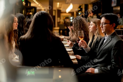 Preview: work colleagues in a restaurant celebrating conclusion of a new deal a successful business proposal