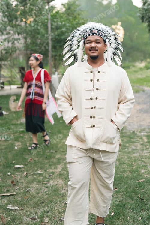 Preview: Man traditional costume feather headdress walking outdoor cultural native celebration man