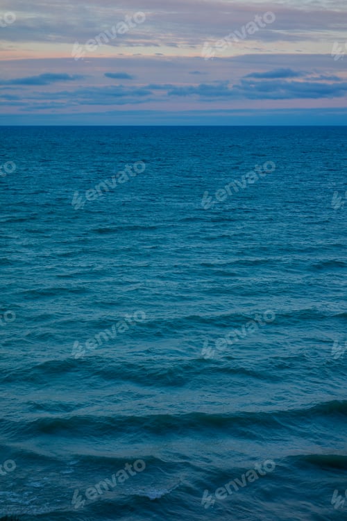 Preview: Scenic view of sea waves at sunset