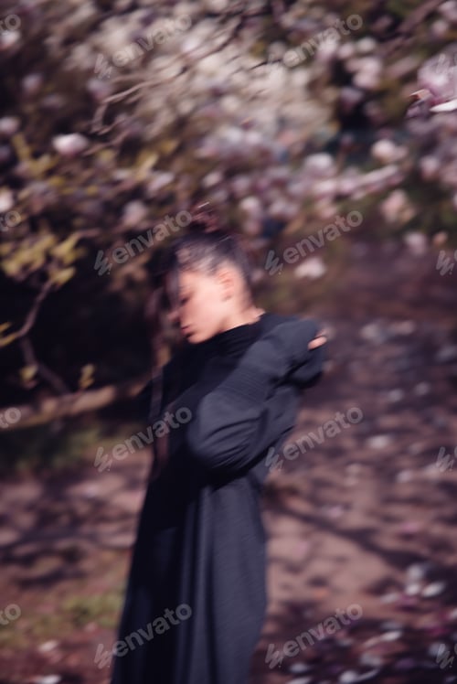 Preview: Beautiful young woman wearing kimono with cherry blossoms, sakura view