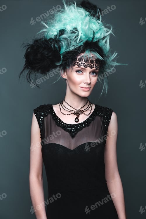 Preview: Beautiful girl in evening dress with avant-garde hairstyles. Beauty the face.