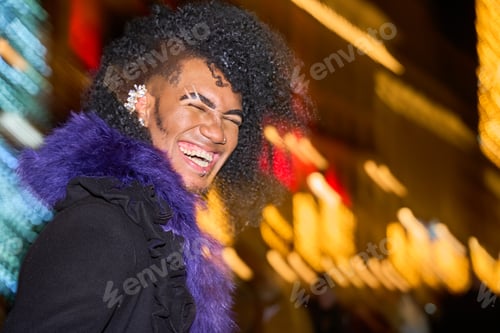 Preview: Young drag queen laughing in times square at night