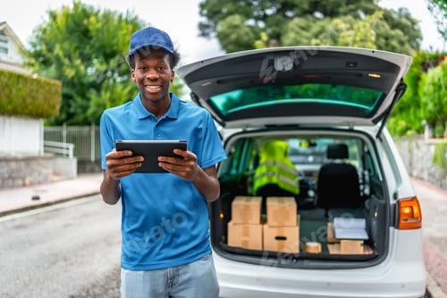 Preview: African delivery man using technology to work to deliver packages