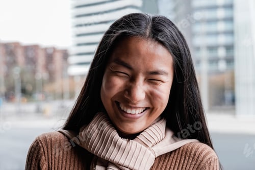 Preview: Happy Asian girl smiling on camera outdoor - Focus on face