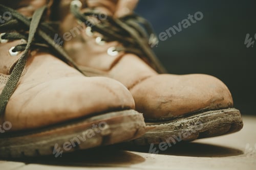 Preview: Old and Dirty boots in mud