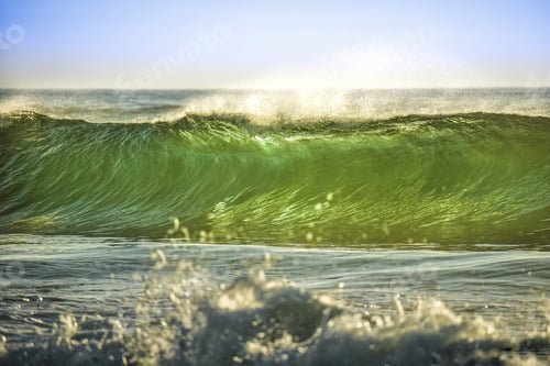 Preview: A green wave rolls in to the beach showing the beauty and the power of the ocean