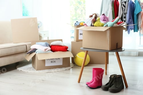 Preview: Carton boxes with donations in living room