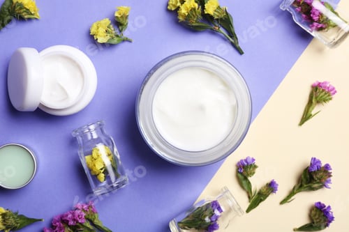 Preview: Flat lay composition with jars of body cream on color background