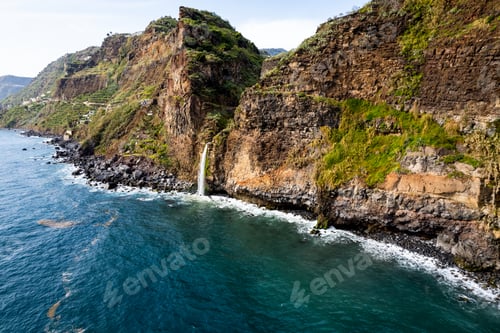 Preview: Waterfall fall into Atlantic Ocean in Madeira Island, Portugal. Aerial Drone view