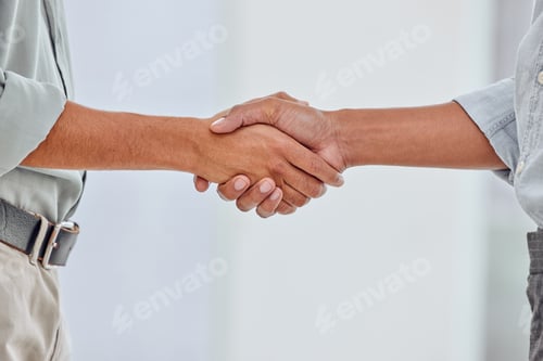 Preview: Welcome to the company. Shot of two unrecognizable people shaking hands against a white background.