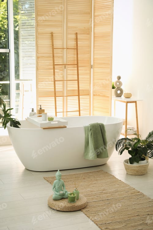Preview: Stylish bathroom interior with modern tub and beautiful houseplants