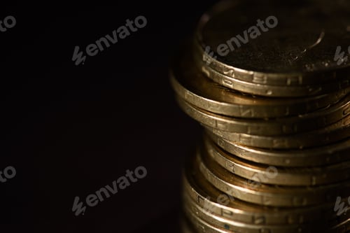 Preview: close up view of pile of coins isolated on black