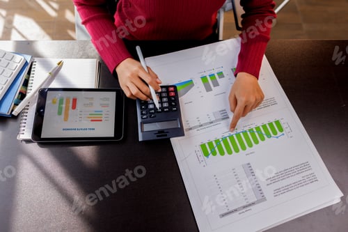 Preview: Business accountant or financial expert analyze business report graph and finance chart at corporate