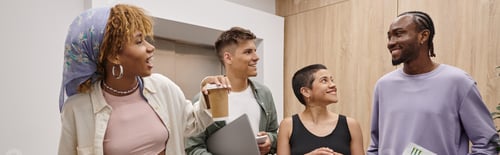Preview: cultural diversity, positive interracial men and women walking together in modern coworking, banner