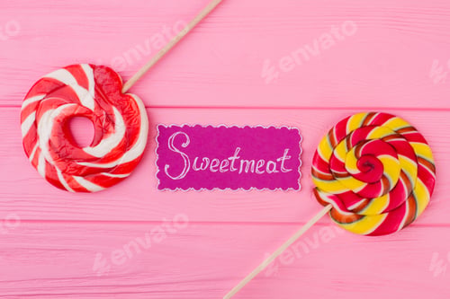 Preview: Pink background with colorful lollipops.